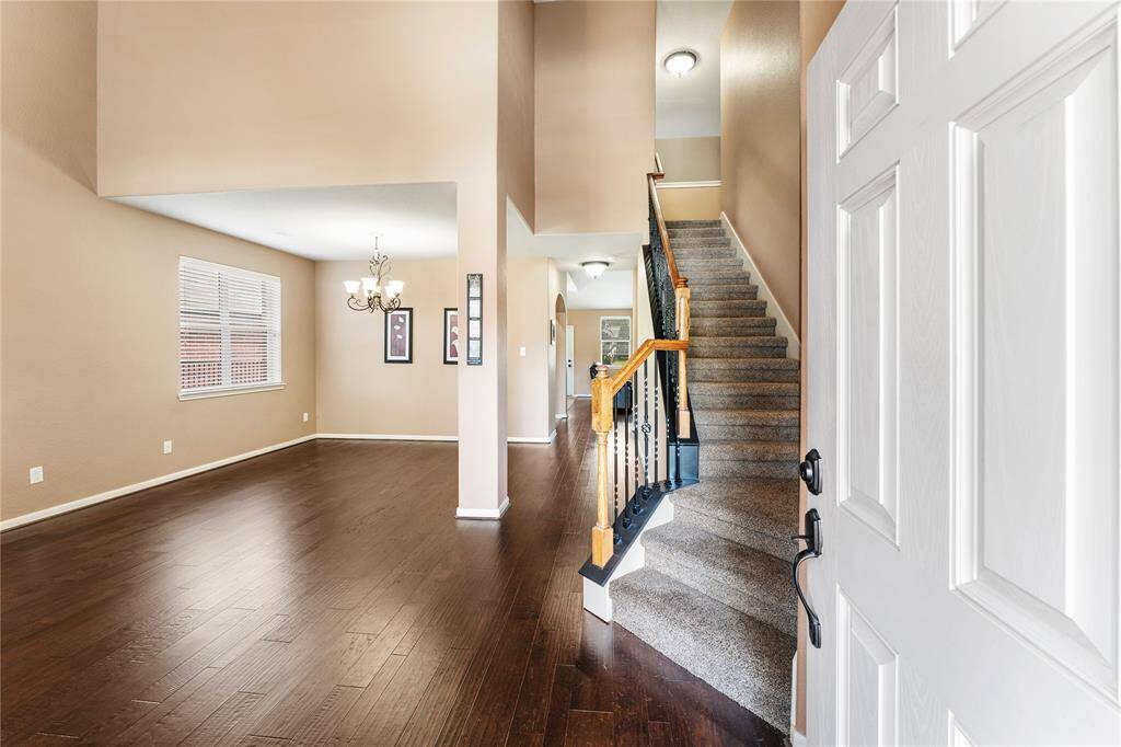A welcoming foyer with high ceilings will welcome your guests