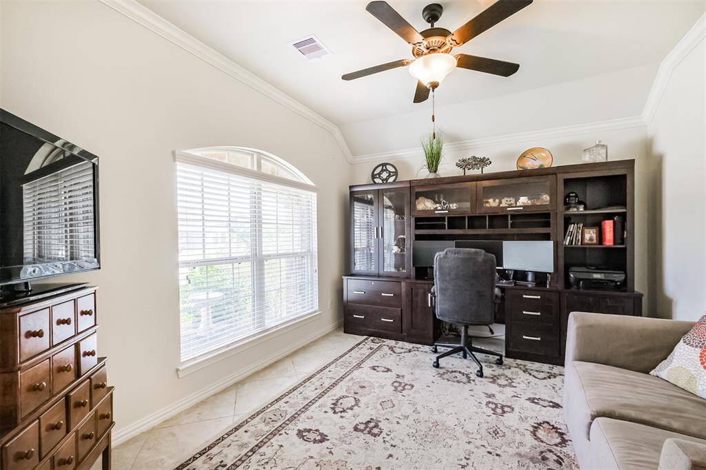 Lots of space in this front room. Currently an at home office