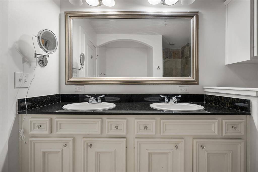 Primary bathroom with double vanities.