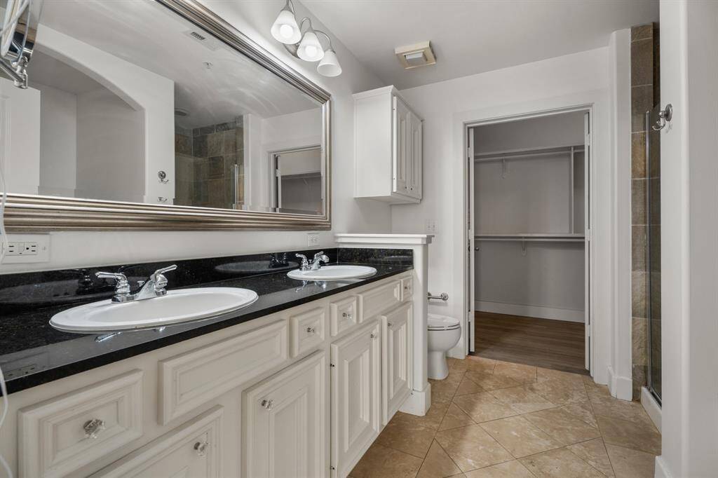 Oversized primary bathroom with large walin-in closet.