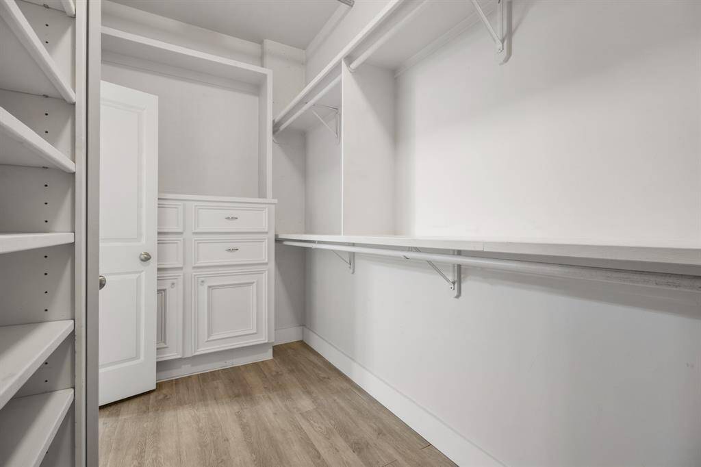 Primary bedroom walk-in closet
