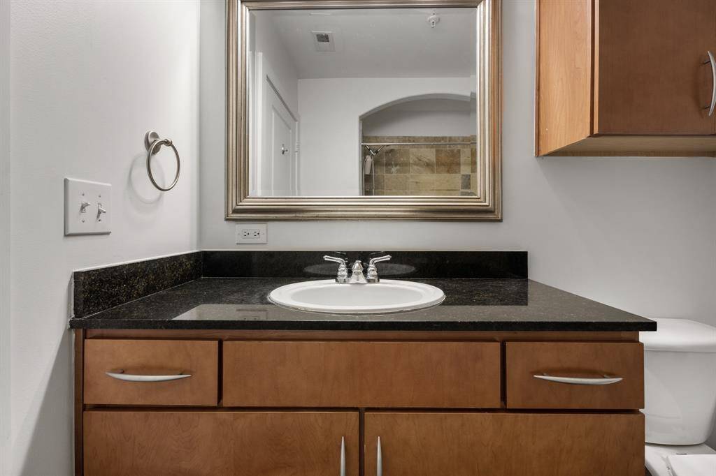 2nd bathroom with granite top vanity.