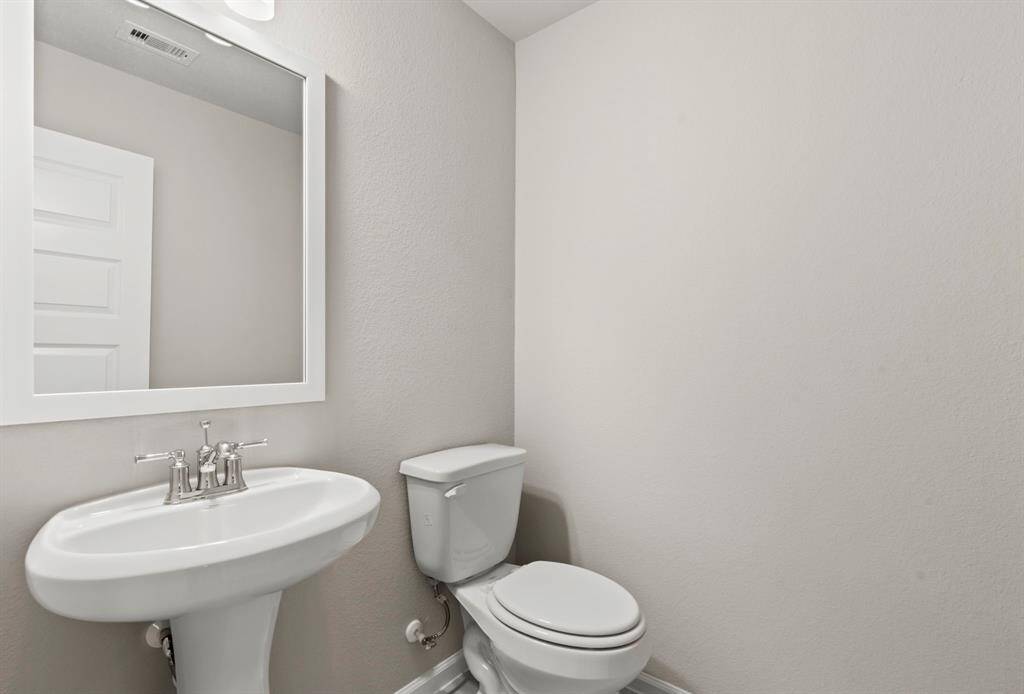 Photos depict a model home built on the same floor plan as the listed property. Variations may exist; visit in person for accurate details