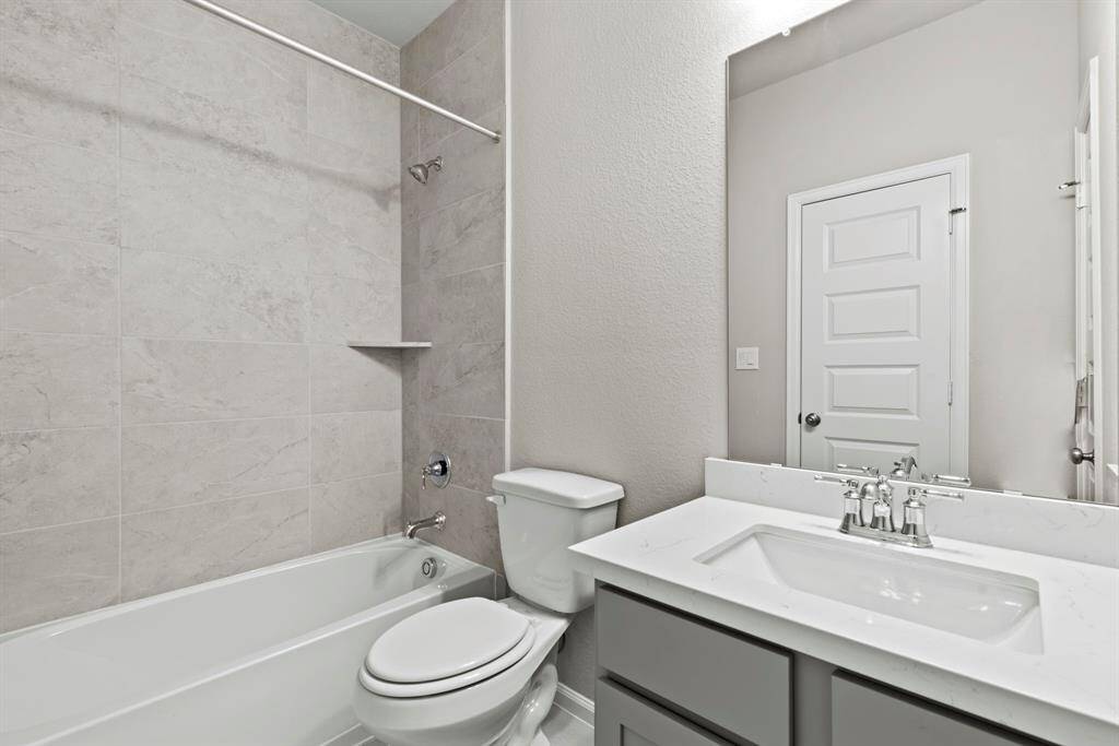 Photos depict a model home built on the same floor plan as the listed property. Variations may exist; visit in person for accurate details