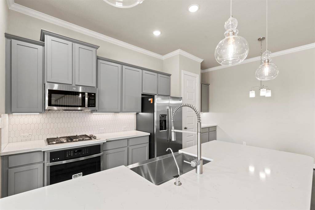 Photos depict a model home built on the same floor plan as the listed property. Variations may exist; visit in person for accurate details