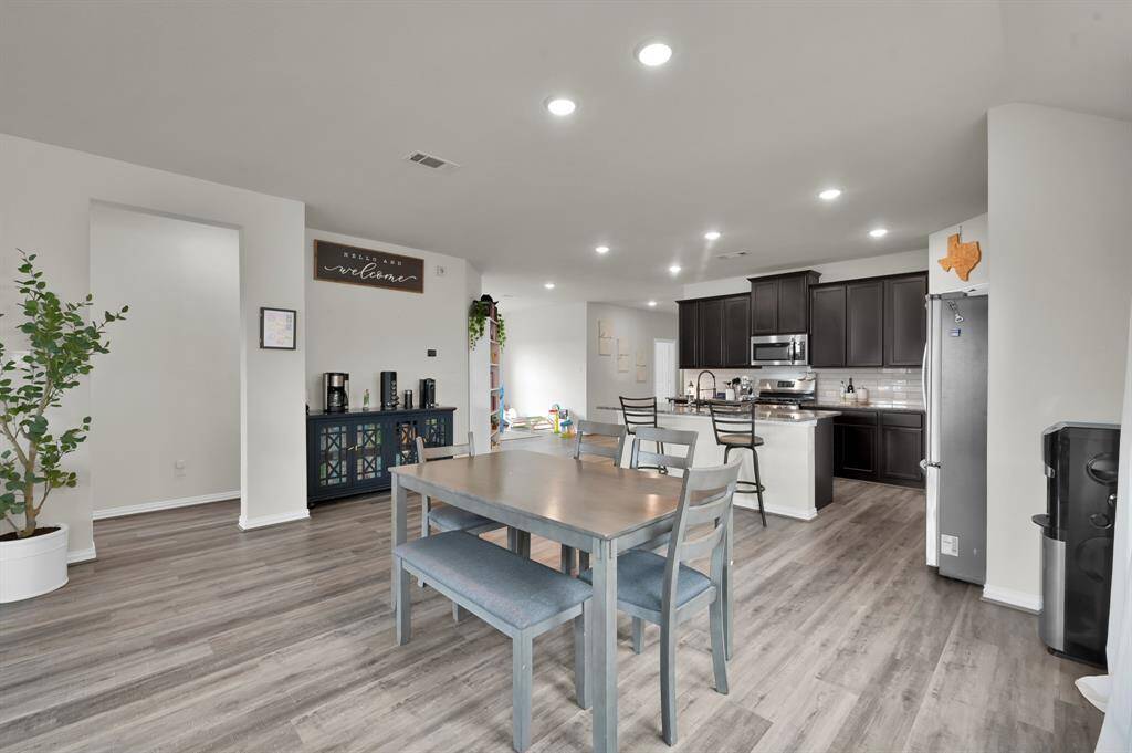 Full view of the open living, kitchen, and dining areas—ideal for modern living.