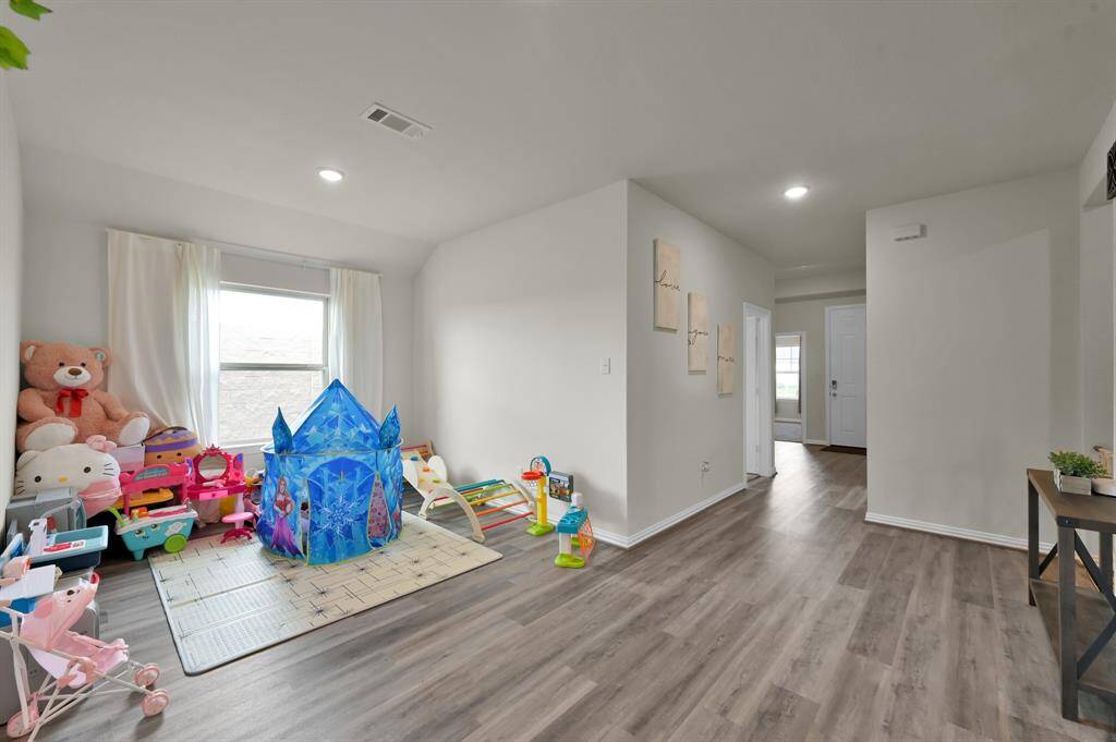 Flex room currently used as a playroom—ideal for a home office, gym, or creative space.