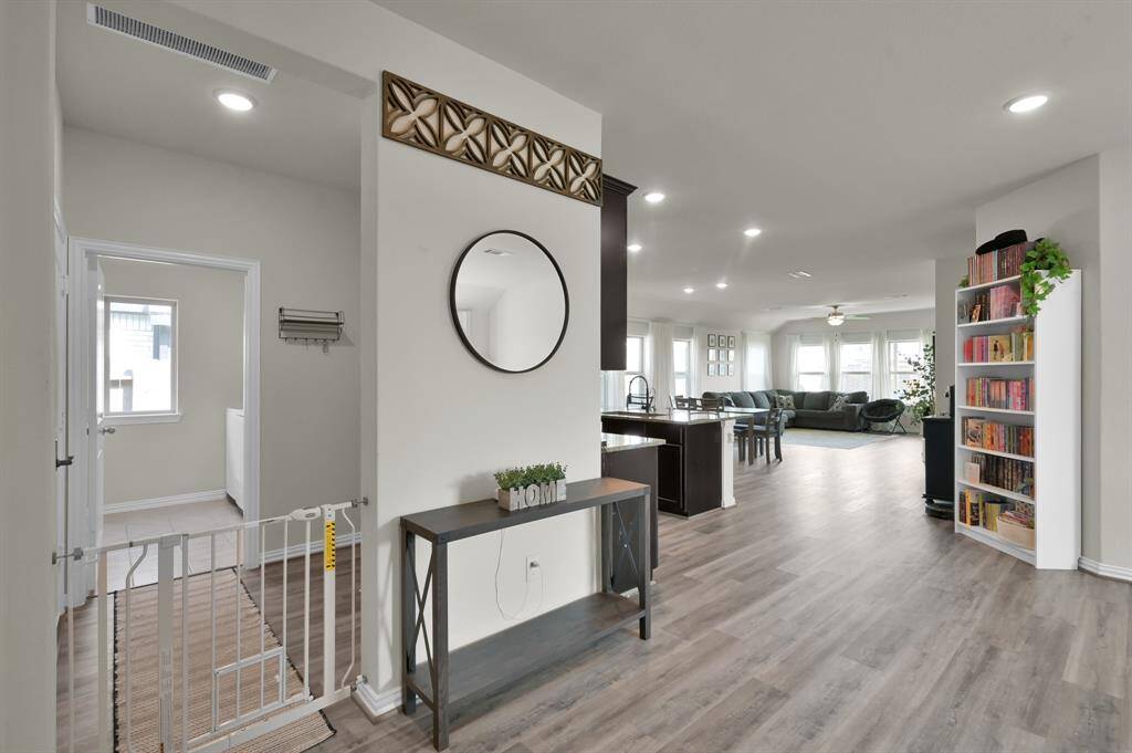 Hallway view showing the spacious flow between bedrooms and main living areas.