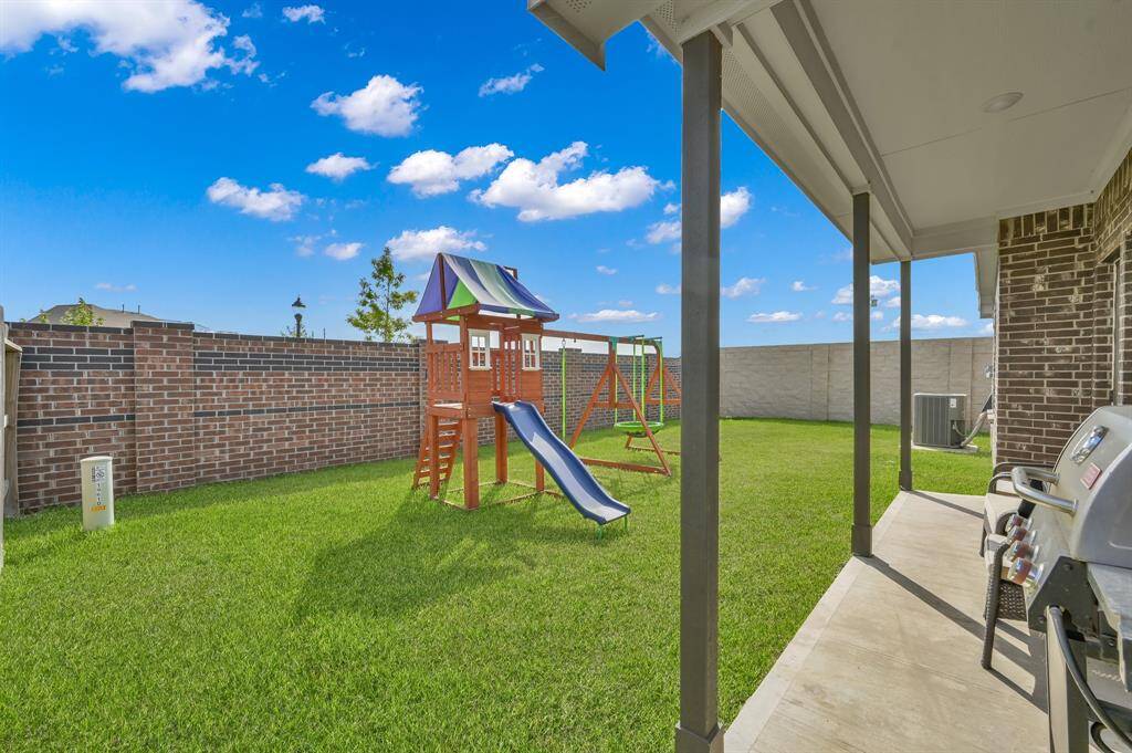 Covered patio ideal for outdoor lounging, BBQs, and relaxing evenings. No back neighbors, either!