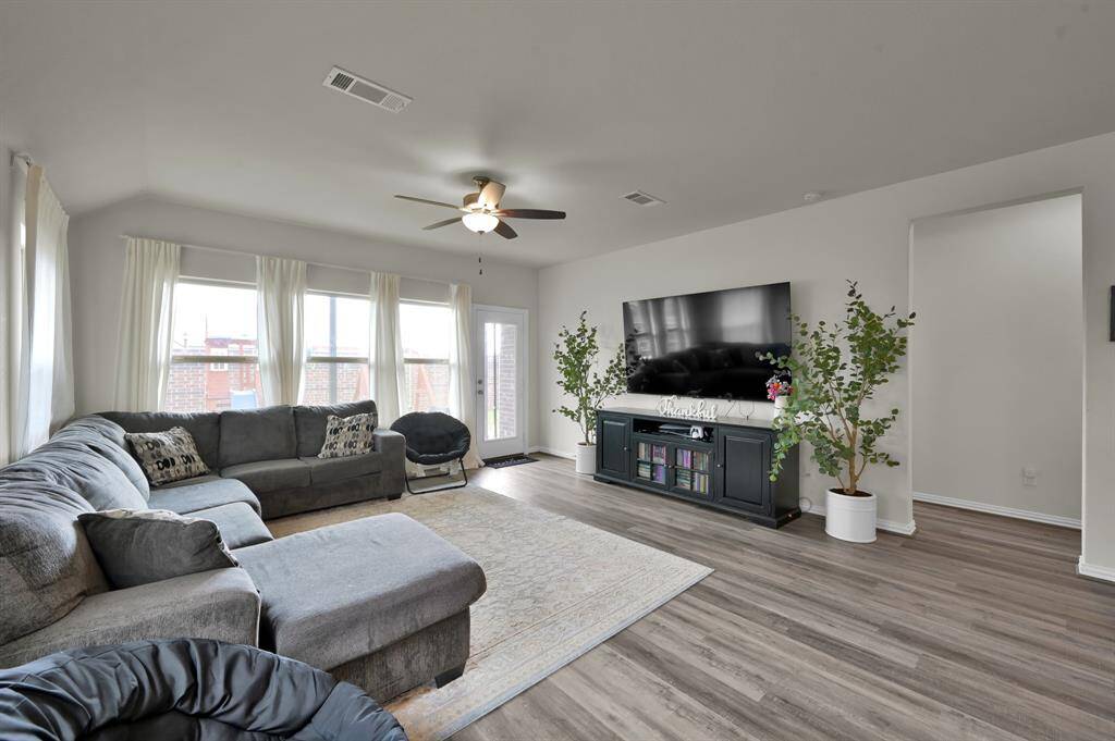 Another view of the cozy living room, seamlessly connected to the kitchen for an open flow.