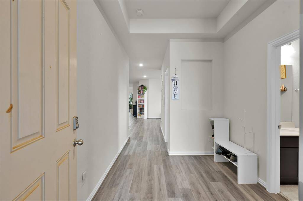 Inviting front entry with a wide hallway and stylish finishes.