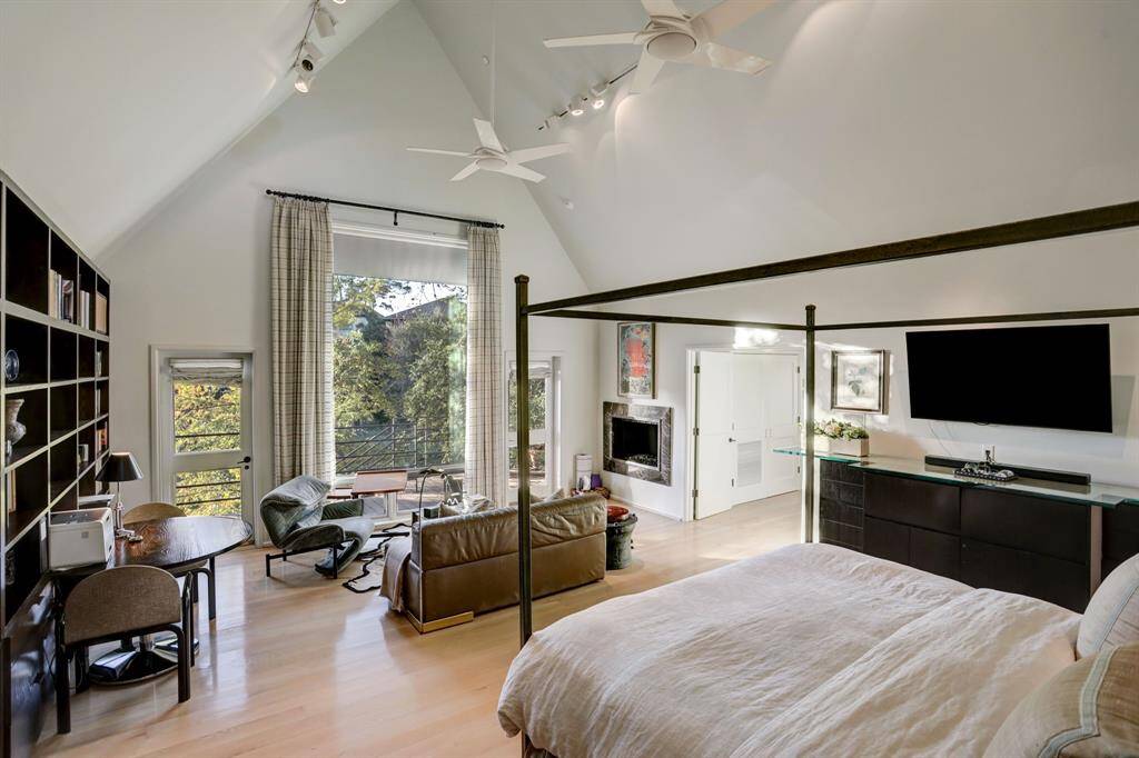 Welcome to this exquisite primary suite! expansive windows, offering picturesque views of the serene outdoors, making you feel as though you are nestled among the trees.