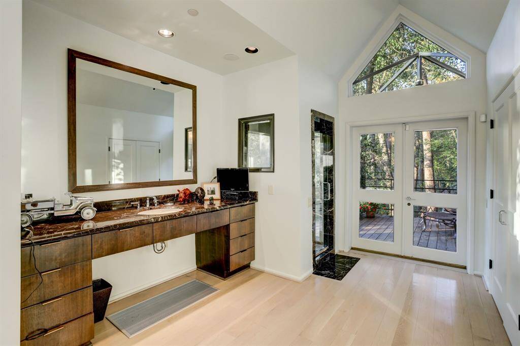 The primary suite with direct access to a beautiful deck.