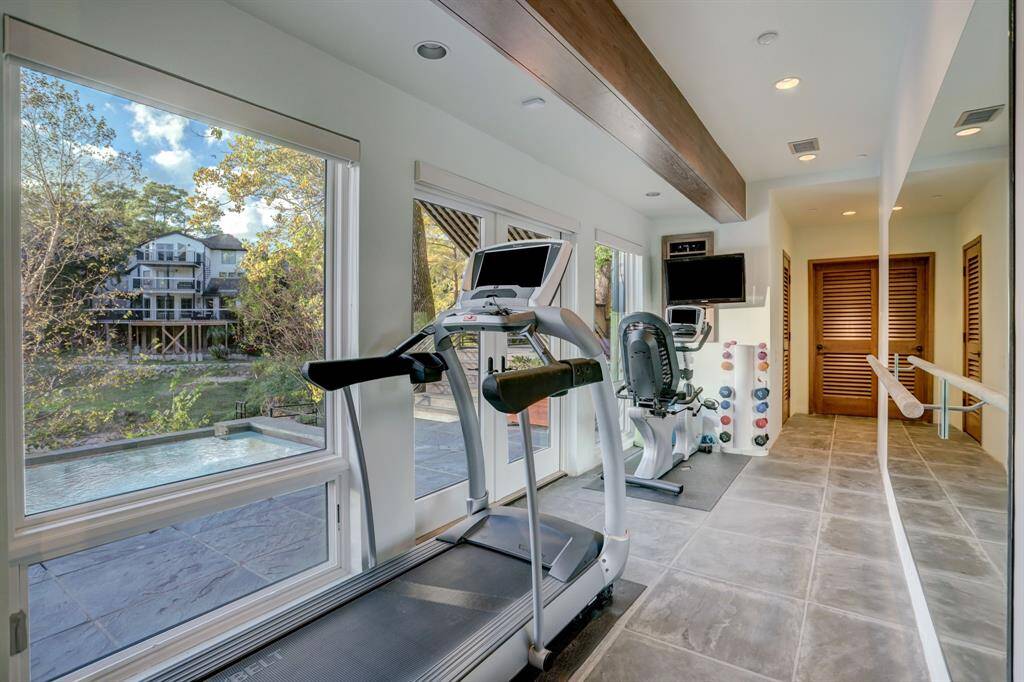 The home gym is ideal situated on the lower level that provides great views while exercising.