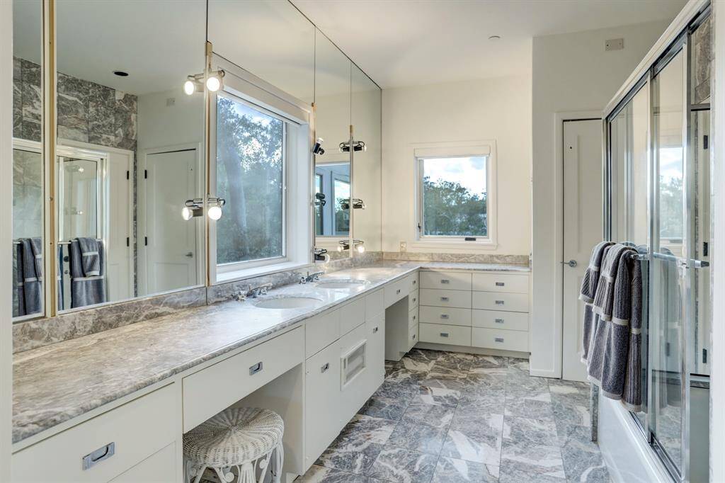 The secondary bedroom bathroom with ample storage space and vanity area.