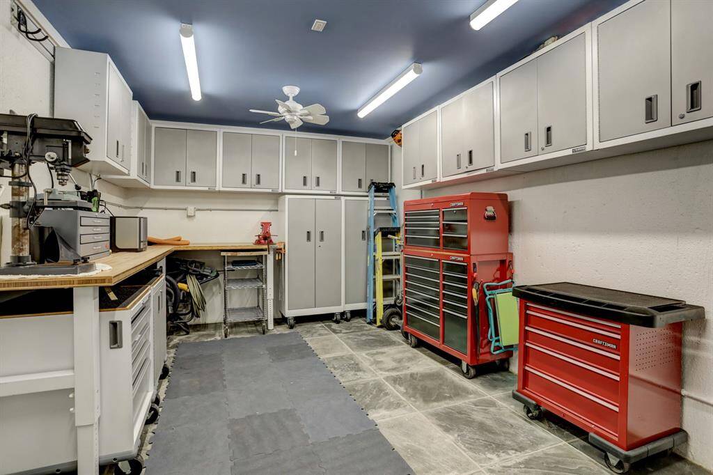 A workshop room located off of the garage.