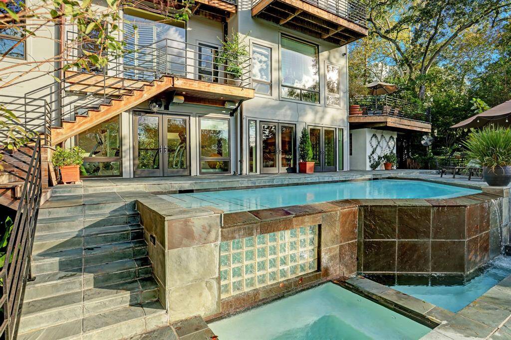 Resort like infinity-edge pool overlooking the bayou.
