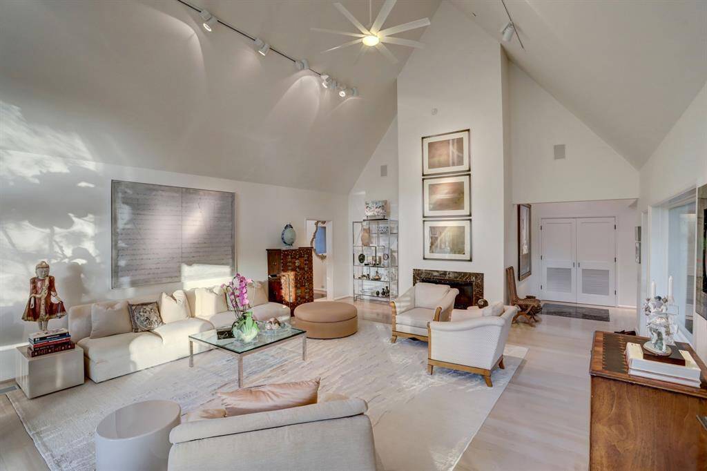 A stately fireplace serves as the focal point, adding warmth and charm to the setting.