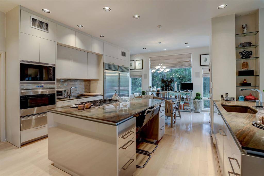 The centerpiece is a large island, perfect for cooking and entertaining.
