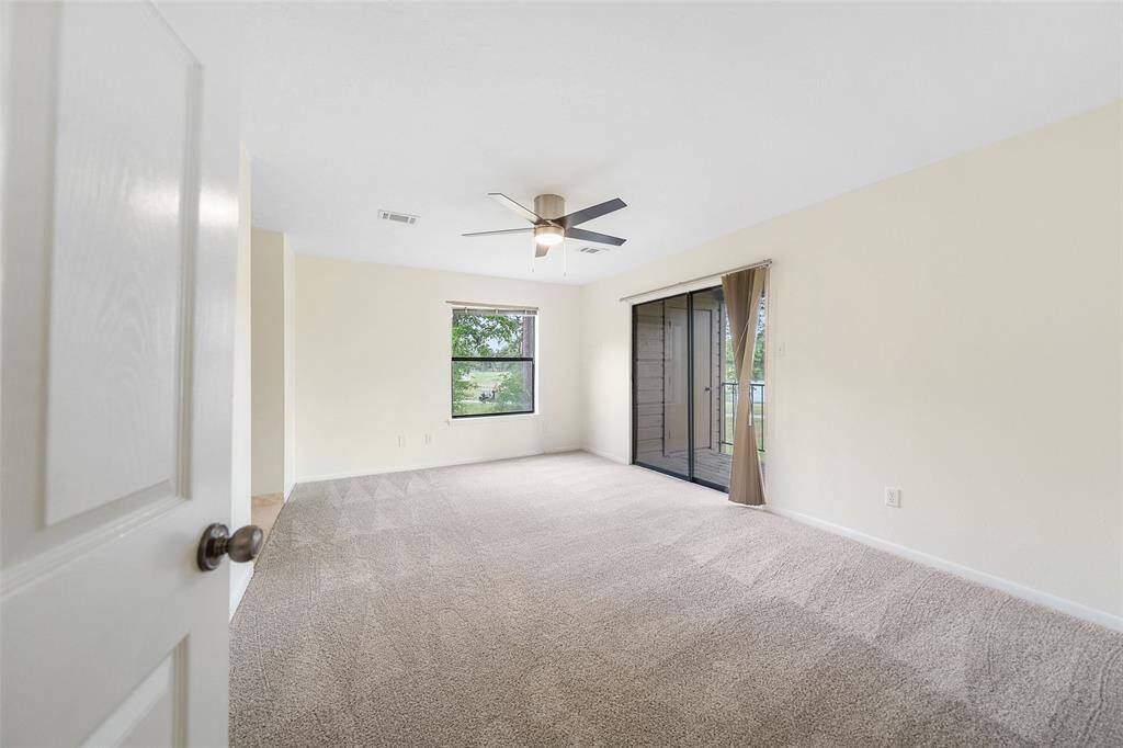 Primary bedroom with balcony