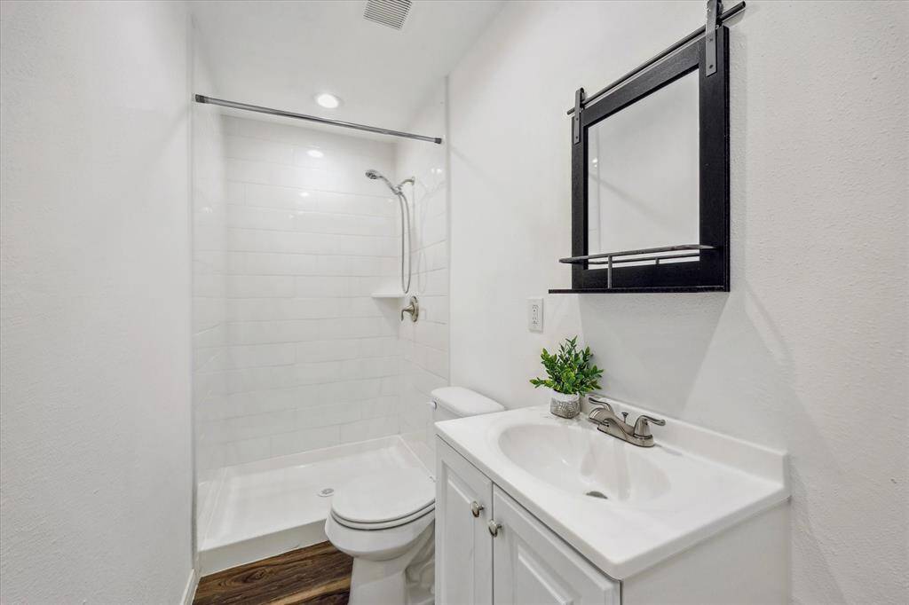 Complete with a full bath, this separate suite includes a walk-in shower, modern vanity, and clean finishes—offering comfort and convenience for guests.