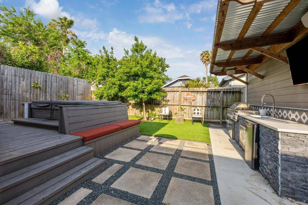 Host with ease in this versatile backyard retreat, featuring built-in bench seating, a cozy lounging area, and low-maintenance turf. Whether you're soaking in the sun or enjoying quiet evenings under the stars, this space is ready for relaxation and connection.