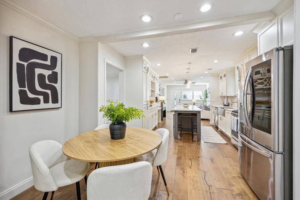Enjoy effortless flow in this open-concept layout, where the dining area offers space for seated meals while the expansive island provides additional room for casual dining or entertaining.