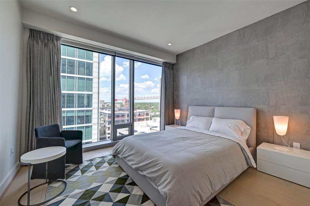 One of the secondary bedrooms in this residence with ample room for a huge bed, extra furniture, shelves, and other bedroom essentials.