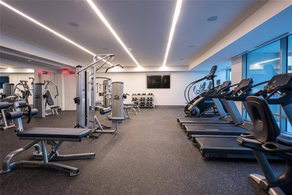 Fitness Center with Pool view, top of the line equipment.