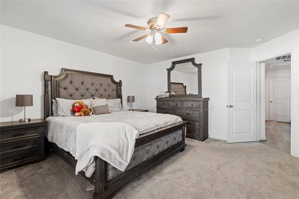 Primary bedroom retreat offering comfort and style with plenty of natural light.
