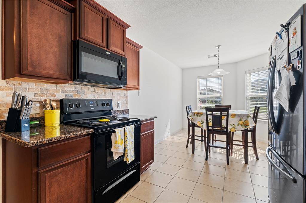 Bright and airy kitchen with plenty of counter space and storage options.