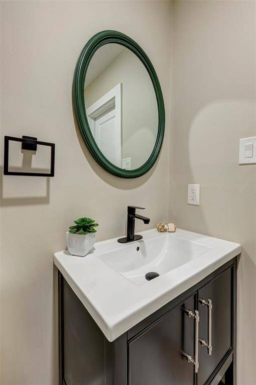 The downstairs powder bath is conveniently located off of the living room but tucked away for privacy.