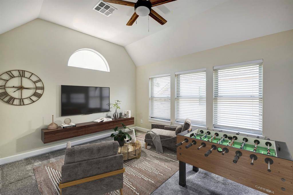 Virtually staged. This flex space can work as a game room, work out space or reading nook is at the top of the stairs just off of the second bedroom.