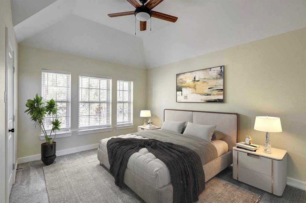 Virtually staged. This second bedroom has an en-suite bathroom with walk-in closet.