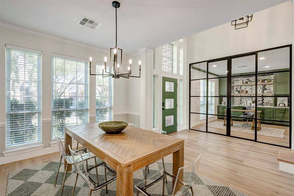 Another view of the dining room looking towards the stunning home office with beautiful sliding steel doors.