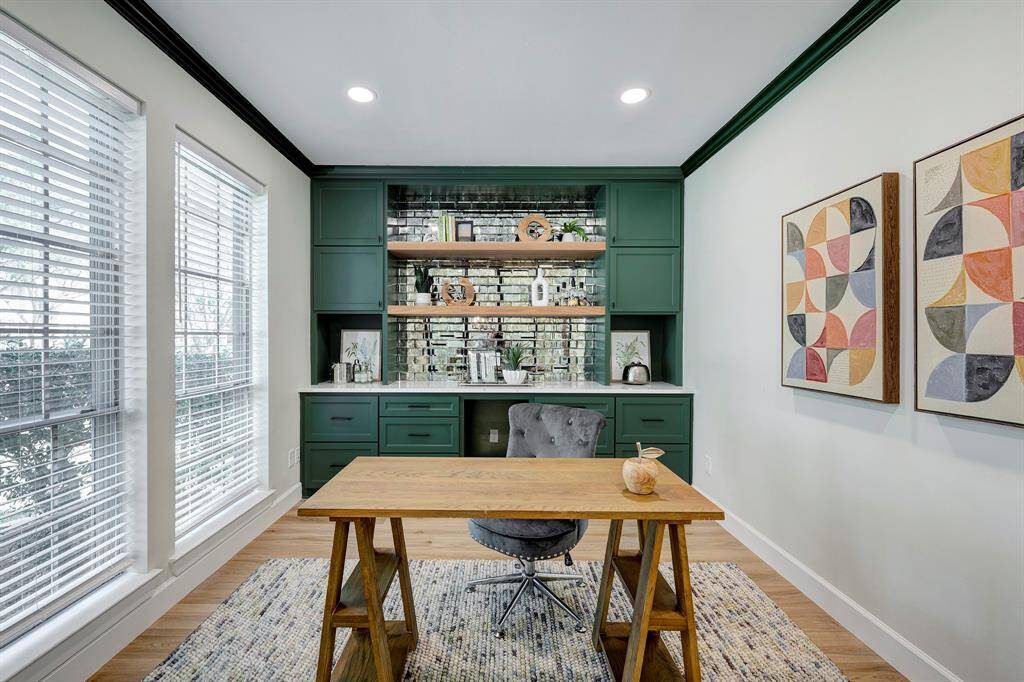 The designer office is behind custom sliding glass partition doors right as you walk in.