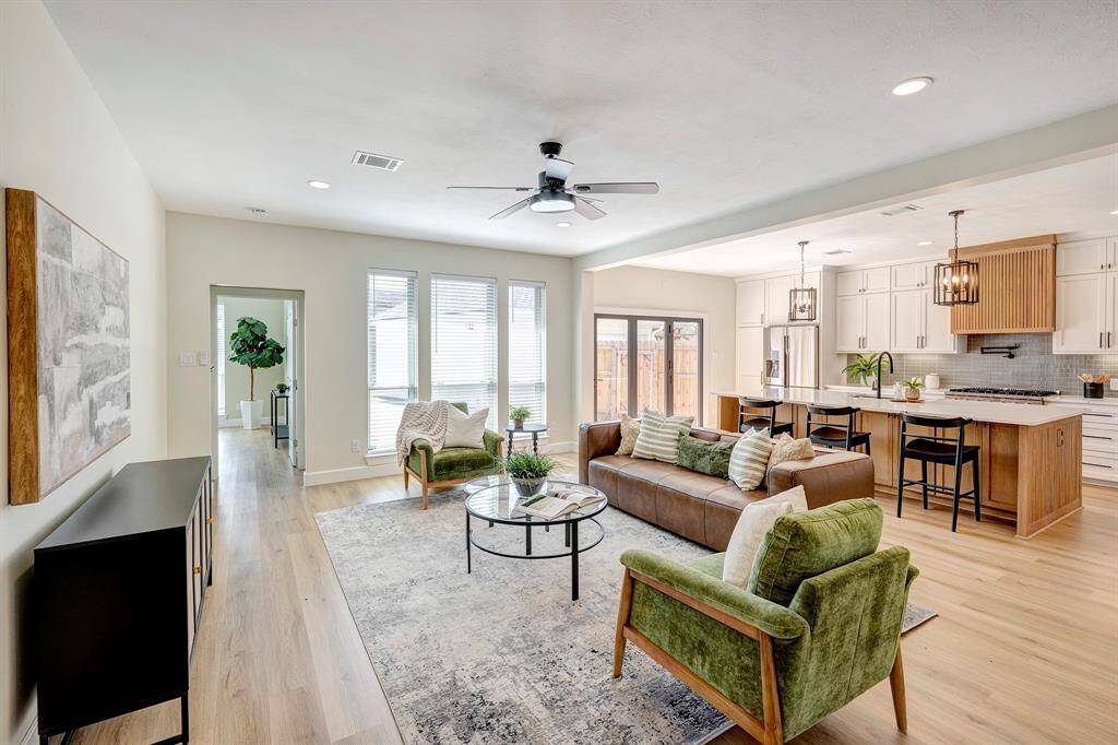 The open concept living room is right off of the kitchen providing ample space for entertaining.