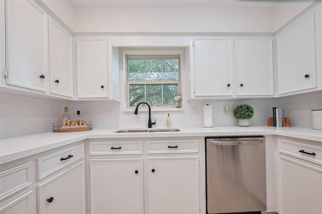Kitchen featuring granite countertops and stainless steel appliances.