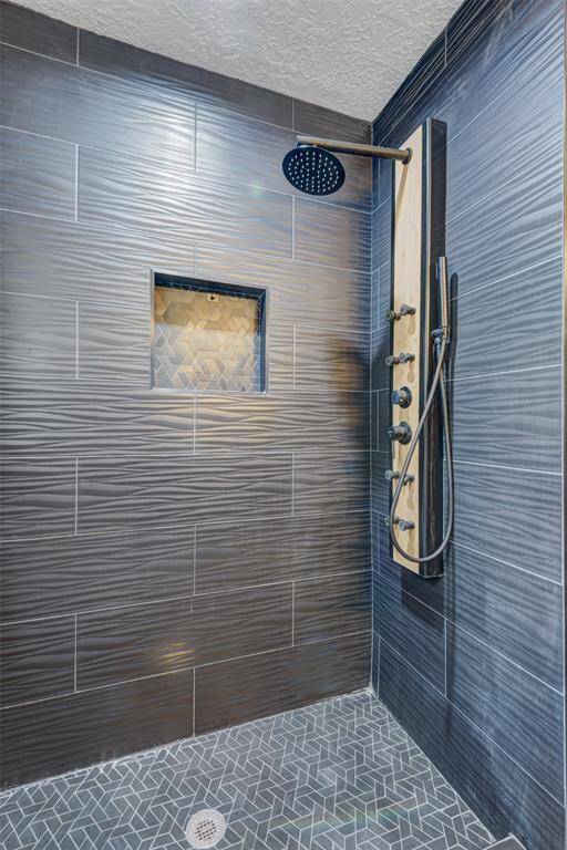 This bath features a stand-in shower with body sprays!
