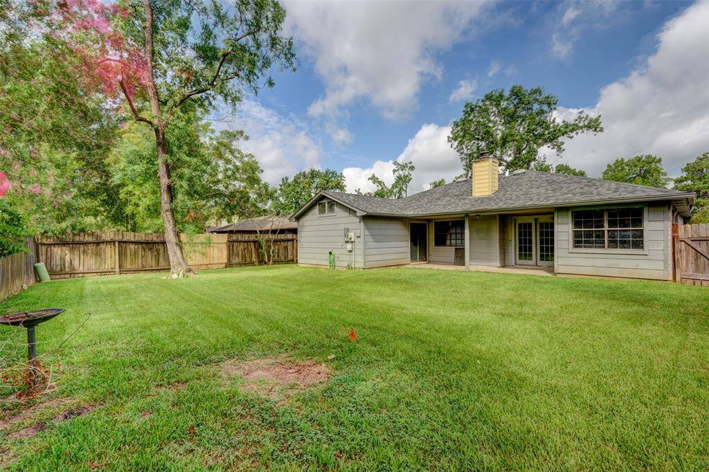Big backyard offers a covered patio with access from the kitchen/living area and from the primary suite!