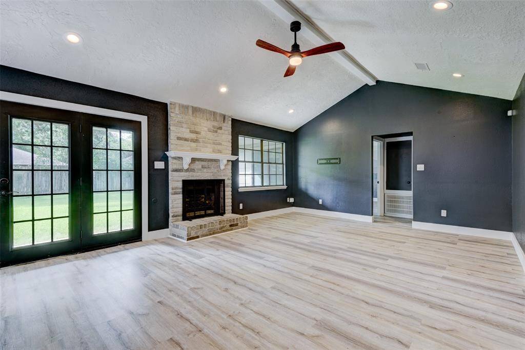 ...fireplace and French doors to the covered back patio