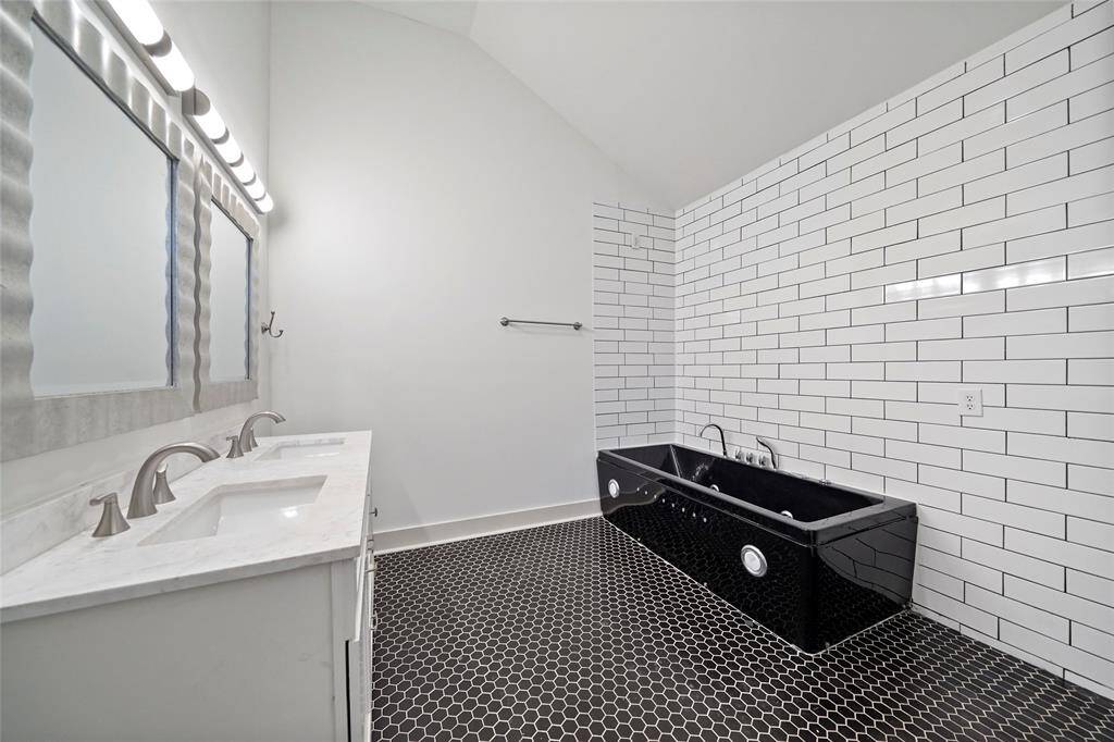 His and Hers sink along with separate soaking tub, perfect place to unwind.