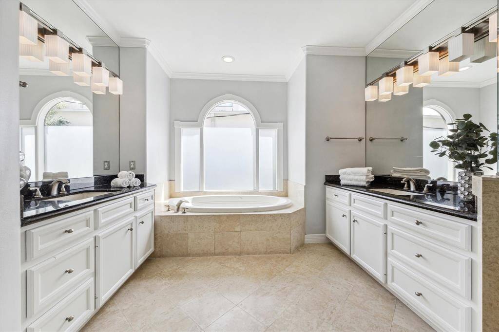 Spacious primary bathroom with beautiful natural light