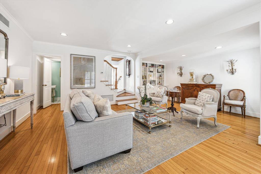Formal living space with bonus nook with built in bookshelves and storage.