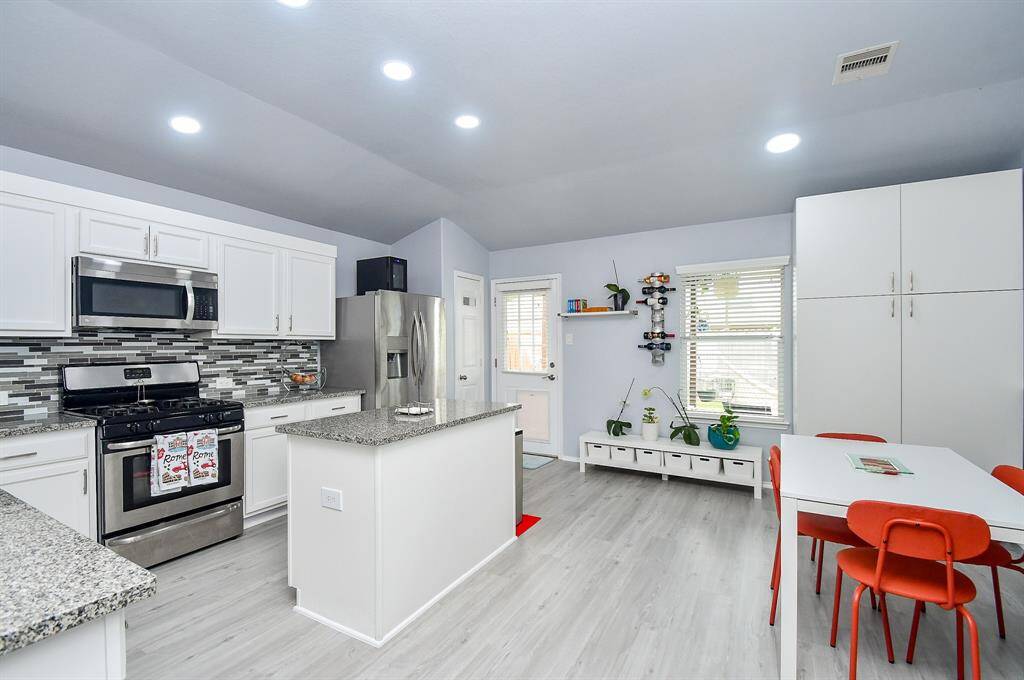 This truly full and workable kitchen will delight any cook or host! Generous floor space makes tasking a breeze, with counters and cabinetry everywhere you step!