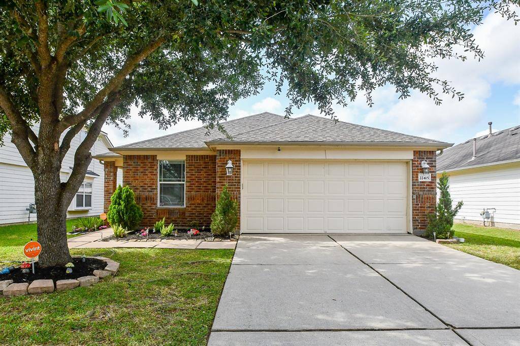 A comfortable driveway lets you simply pull into the attached garage, with room to spare for visitor's vehicles.