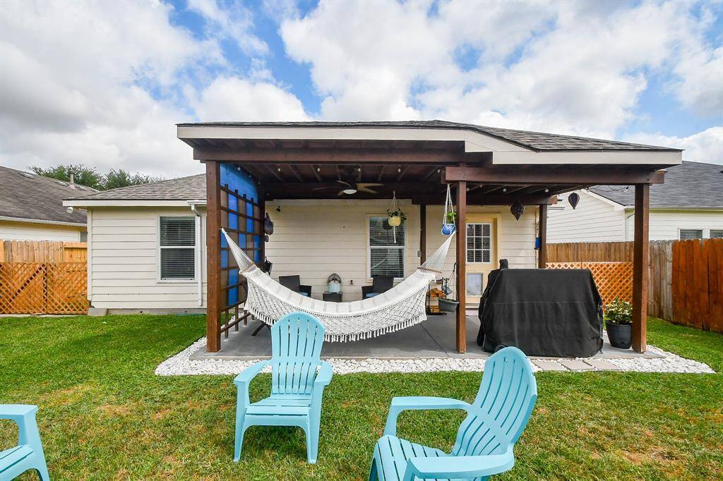 A brief nap before al fresco dining may be just what you need on this divine covered patio.