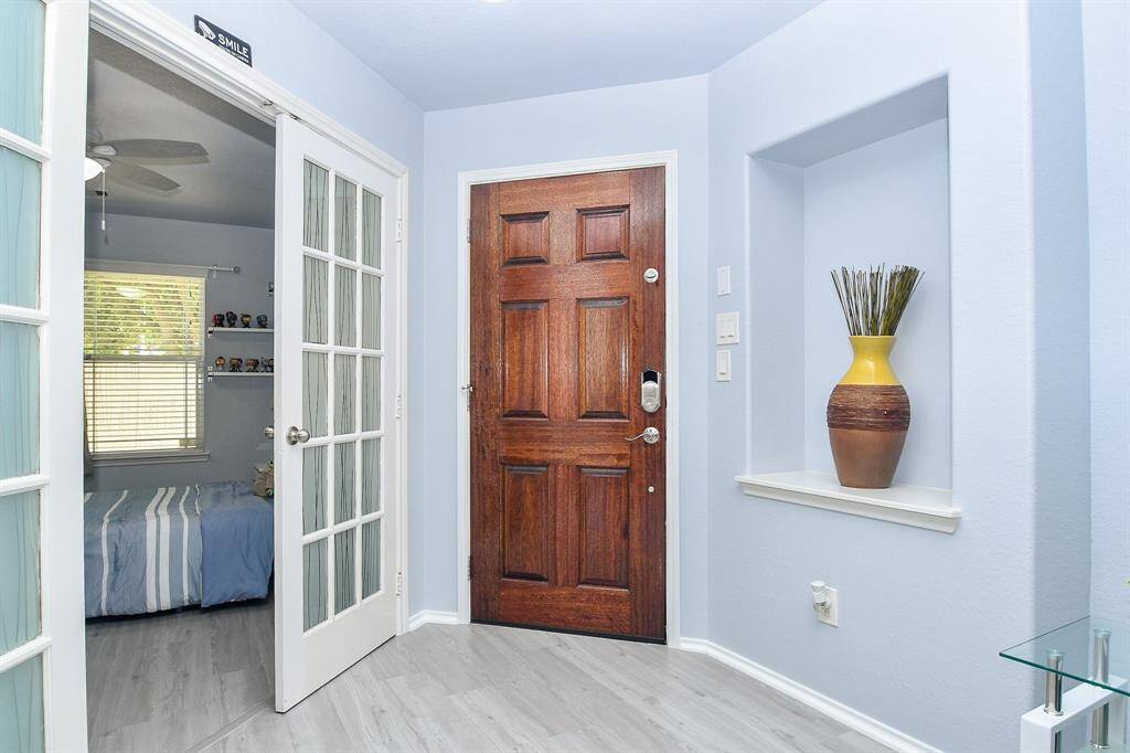 This is the tranquil main entrance, from the inside, with room and wall niches ready to enjoy the imprinting of your own personal lifestyle. To the left, right off the main entrance hallway/foyer, is a bright front room, beyond classic french doors, suitable for a home office, if desired. The home features 4 bedrooms and 2 baths, all occupying a 5,750 square-foot lot with 1,850 square-feet of interior living space.