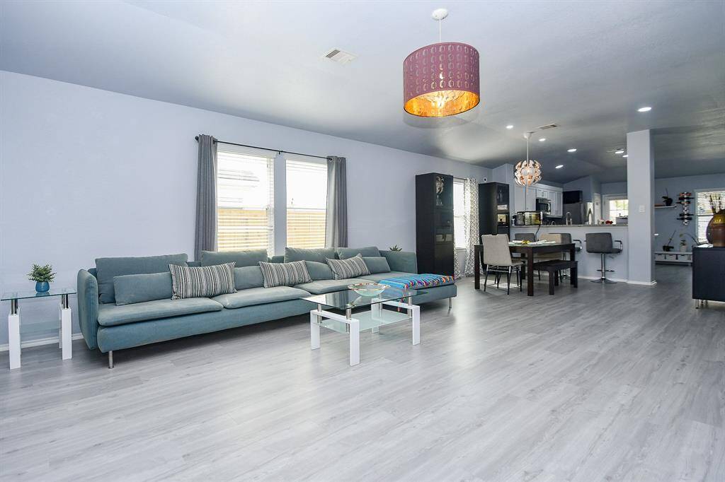 The timeless benefits of the open floor plan design concept are also shown, here, in the combined, easy flowing living/kitchen areas.