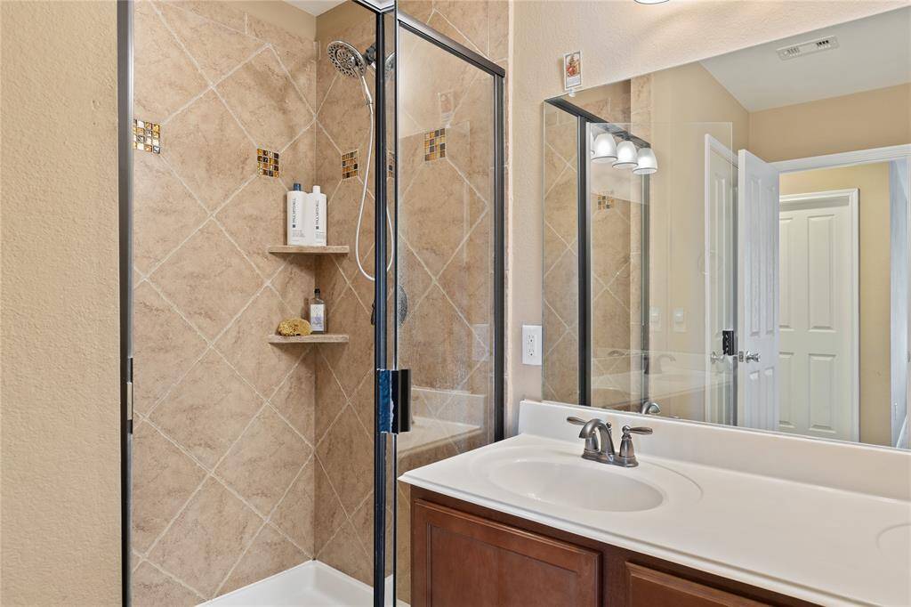 Primary walk in shower with built in seat
